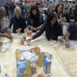 Durban ICC team members adding their effort to the FoodForward SA Food Drive on Nelson Mandela Day 2018